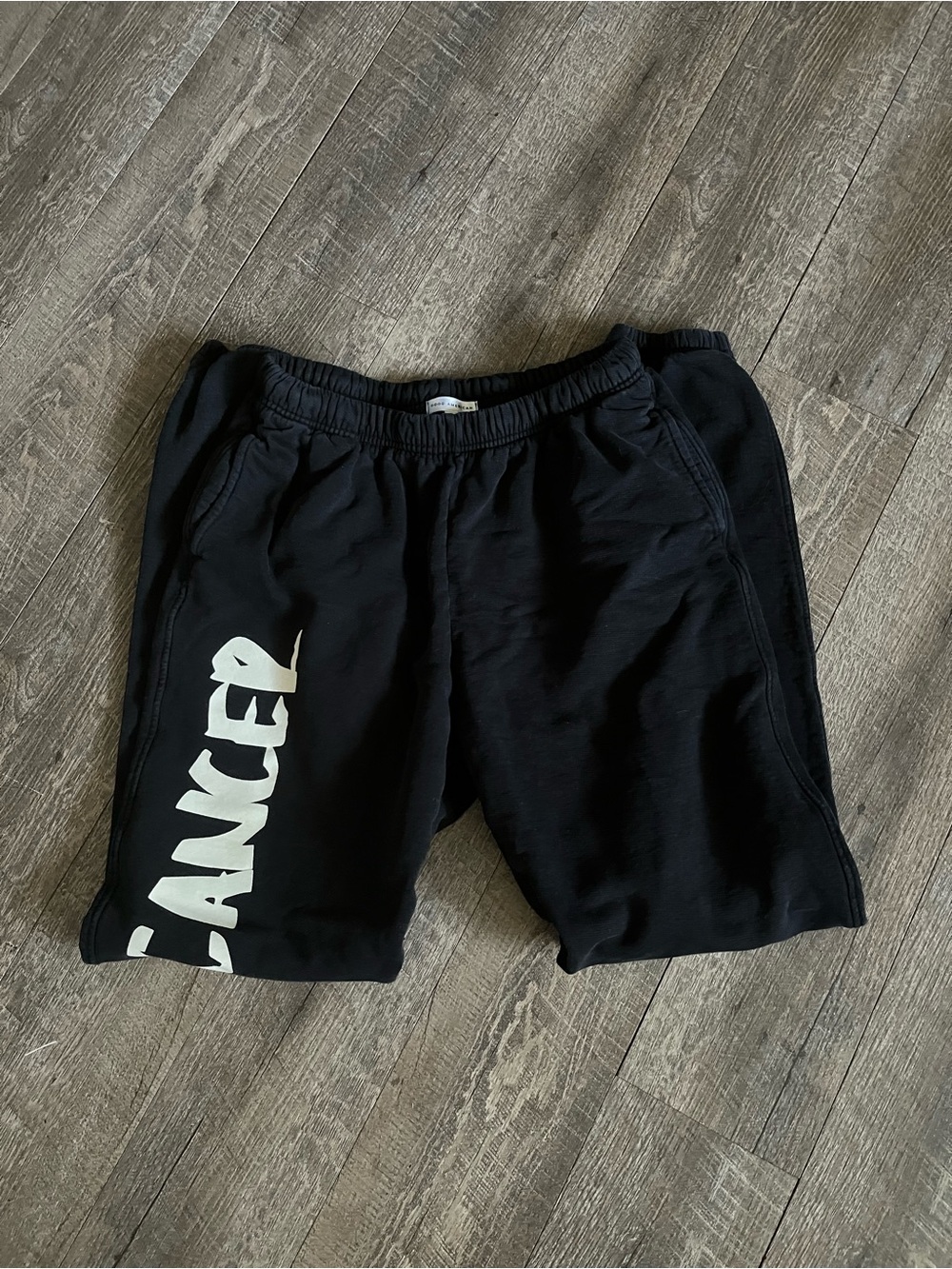 Good American Black Shorts with White 'Cancer' Graphic